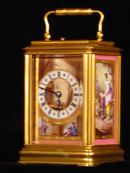 Cannelee cased carriage clock with three fine panels