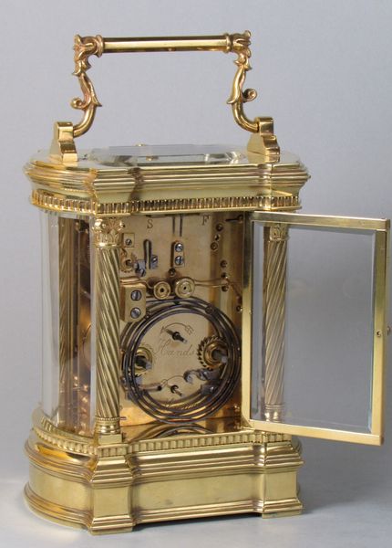Bowed side French carriage clock with black dial