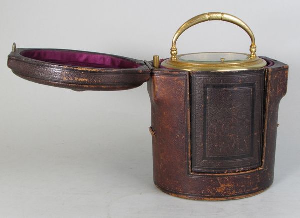 An engraved oval carriage clock