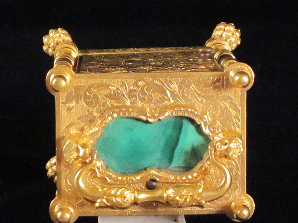 miniature engraved carriage clock on stand with malachite panels.