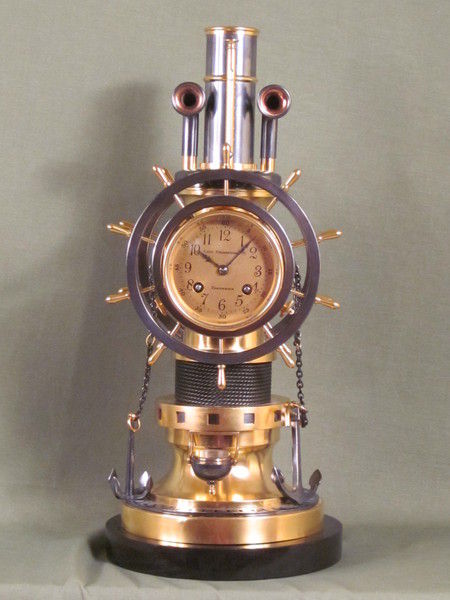 complex maritime industrial clock by Guilmet with moving ships wheels.