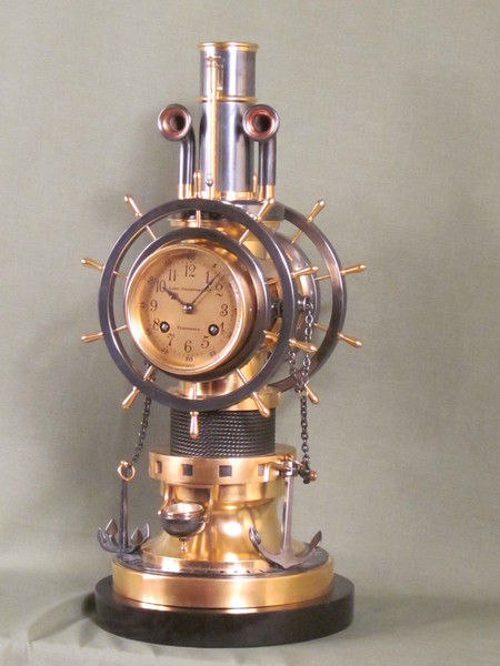 complex maritime industrial clock by Guilmet with moving ships wheels.