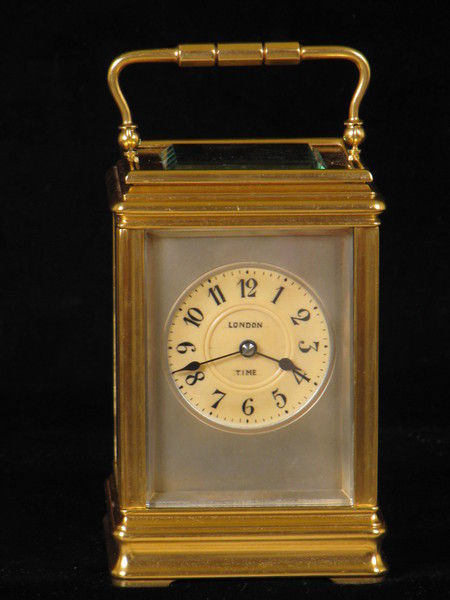 clock with dials on four sides indicating time in London,Paris, New York