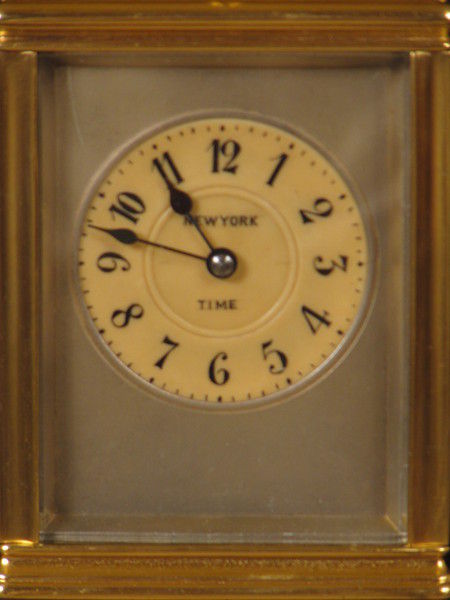 clock with dials on four sides indicating time in London,Paris, New York