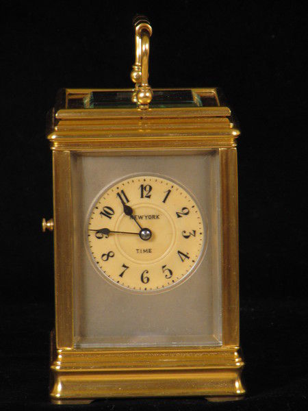 clock with dials on four sides indicating time in London,Paris, New York