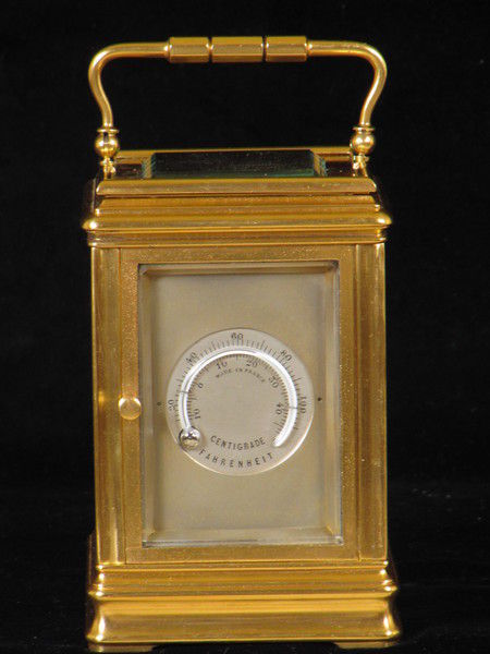 clock with dials on four sides indicating time in London,Paris, New York