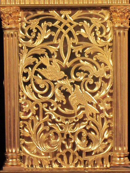 Petite sonnerie carriage clock with fretted out, engraved and gilded panels