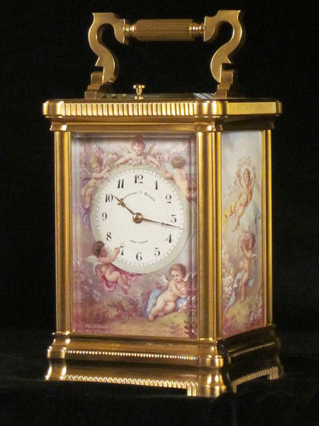 An extremely fine enamel panelled carriage clock with original box.