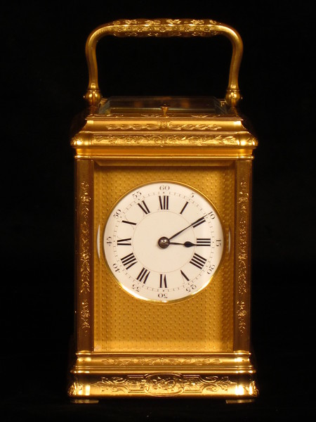 An engraved and gilded gorge cased carriage clock by Richard and Company