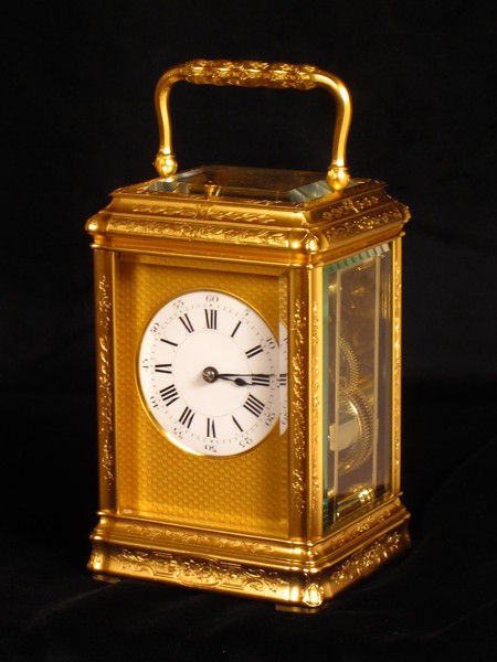 An engraved and gilded gorge cased carriage clock by Richard and Company