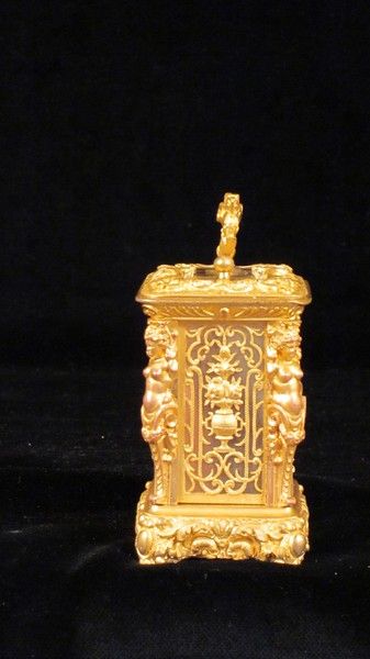 Miniature carriage clock with carytids, engraved panels and original case.  