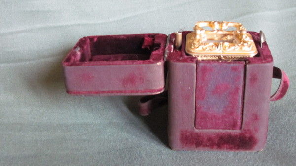 Miniature carriage clock with carytids, engraved panels and original case.  