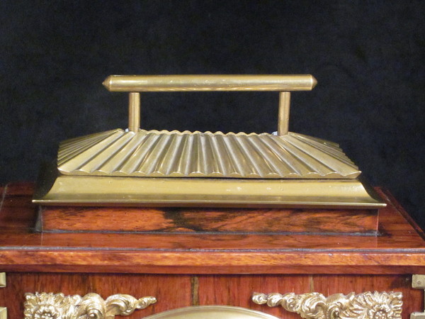 small rosewood bell striking clock with concealed handle by Alabone,1840..  