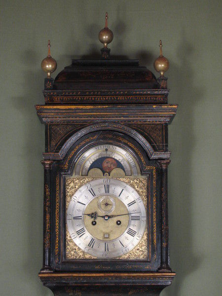 fine green lacquer longcase showing high water and phases of the moon.