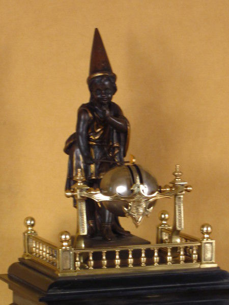 rare automaton clock with wizard striking the quarters on four bells