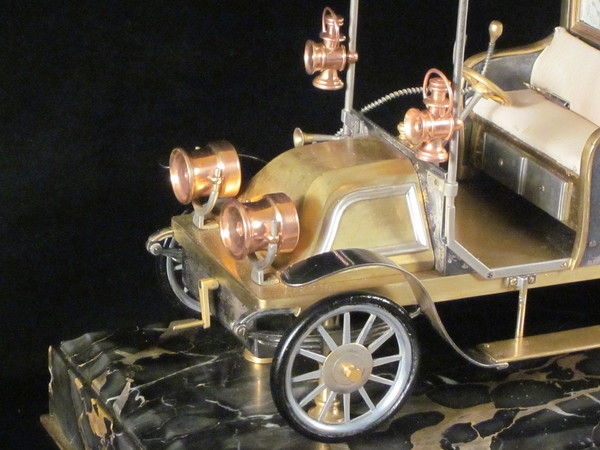A rare automaton car clock by Guilmet, 