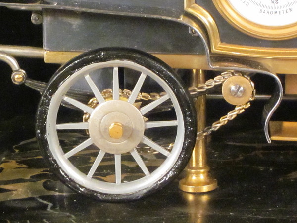 A rare automaton car clock by Guilmet, 