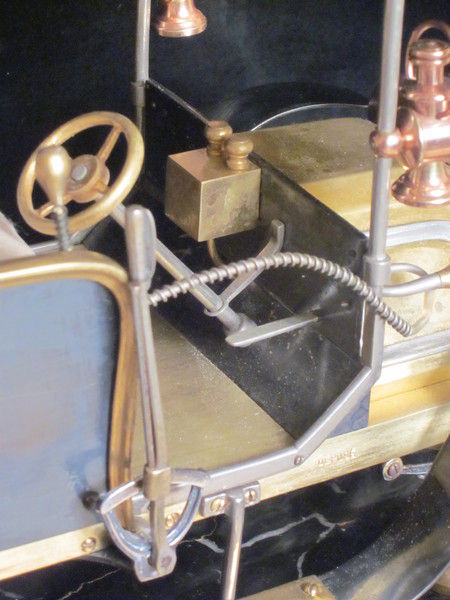 A rare automaton car clock by Guilmet, 
