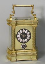 Bowed side French carriage clock with black dial