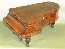 Miniature rosewood necessaire in form of a grande piano, with music box