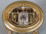 An engraved oval carriage clock (Paris)