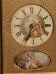 rare strike and repeat carriage clock with oval porcelain panels.  (France)