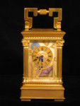 Miniature porcelain panelled carriage clock (France)