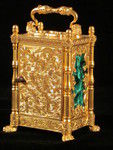 miniature engraved carriage clock on stand with malachite panels. (England)