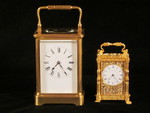 miniature engraved carriage clock on stand with malachite panels. (England)