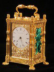 miniature engraved carriage clock on stand with malachite panels. (England)