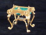 miniature engraved carriage clock on stand with malachite panels. (England)