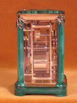 A French carriage clock almost completely covered with solid malachite (France)