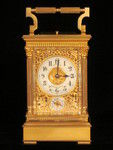 Petite sonnerie carriage clock with fretted out, engraved and gilded panels (France)