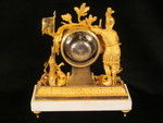 A fine fire-gilt mantel clock featuring a roman soldier and weapons. (France)