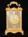 The Basilisk carriage clock, with very finely decorated metal panels.  (France)